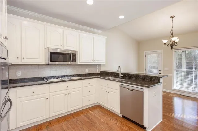an empty room with a ceiling fan and a window