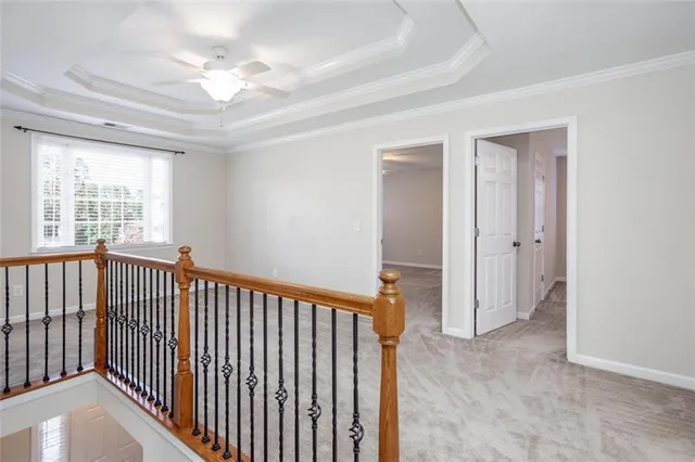 a view of an empty room with stairs