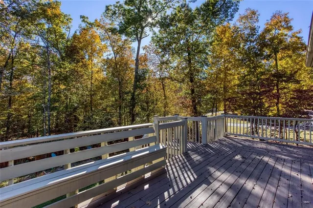 a backyard of a house with garden and outdoor seating