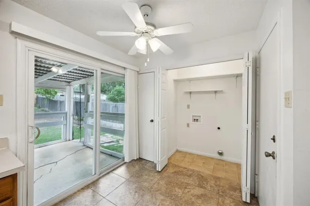 a view of an entryway with wooden floor