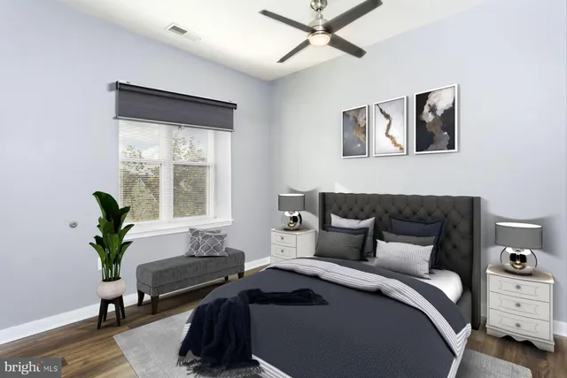 a bedroom with a bed and a window