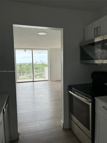 a kitchen with a stove and a microwave