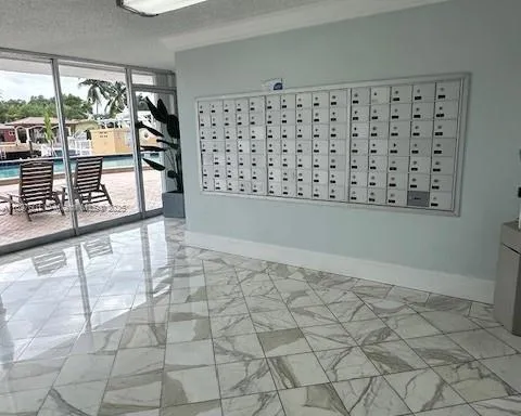 a view of parking garage with cars parked