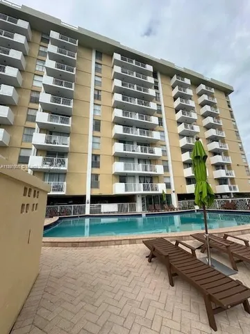 a view of a building with a yard