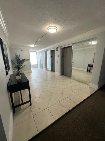 a large bedroom with a bed and a large mirror in it