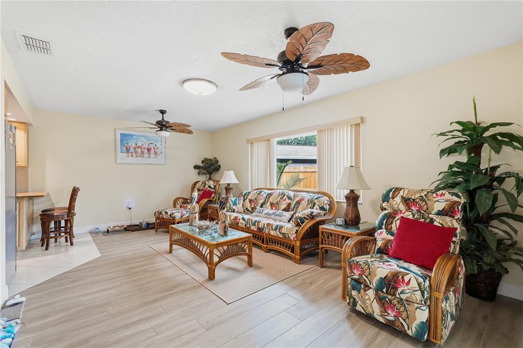 2370 Robyn Court Dunedin, FL 34698 - Photo 11 of 29 a living room with furniture and a wooden floor