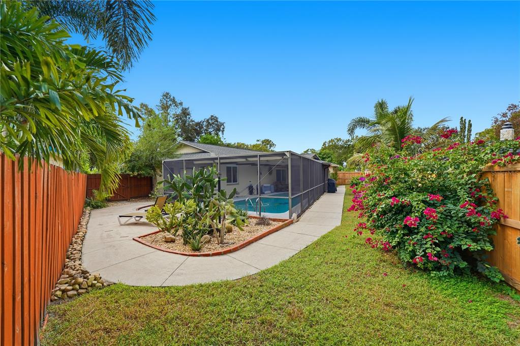 2370 Robyn Court Dunedin, FL 34698 - Photo 25 of 29 a view of a table and chairs in a garden