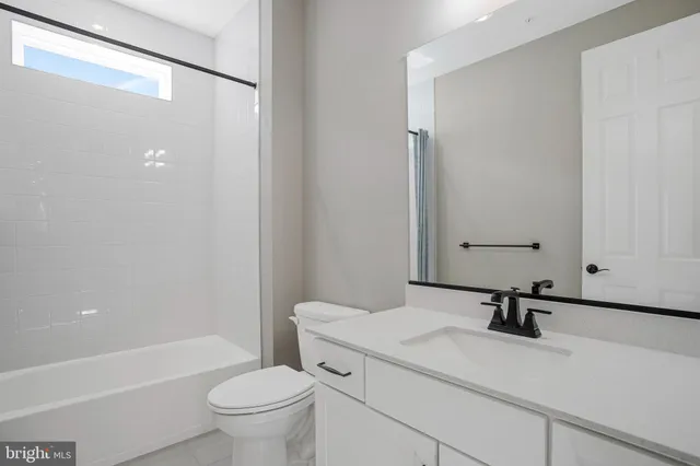 a view of an entryway with wooden floor and door