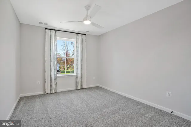 a bathroom with double sink and a mirror