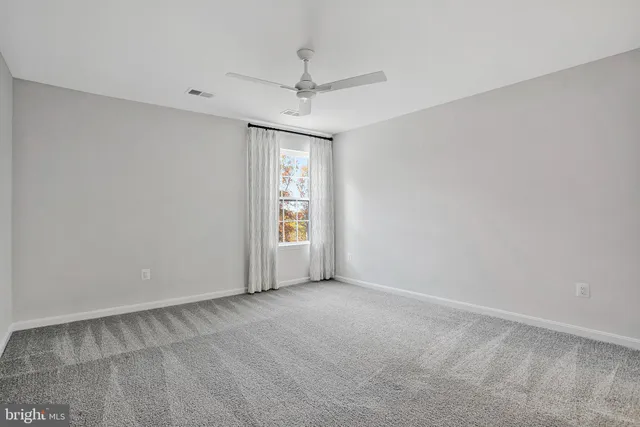 a bathroom with a sink toilet vanity and tub