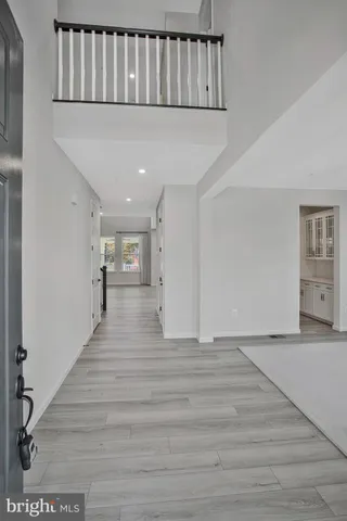 a view of entryway with kitchen