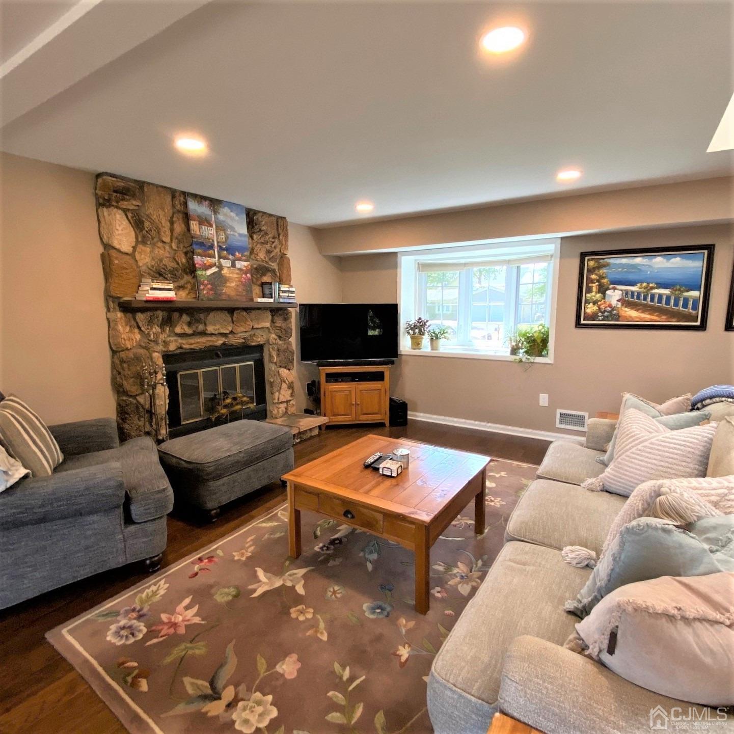 5 Timan Place Piscataway, NJ 08854 - Photo 18 of 27 a living room with furniture and a flat screen tv