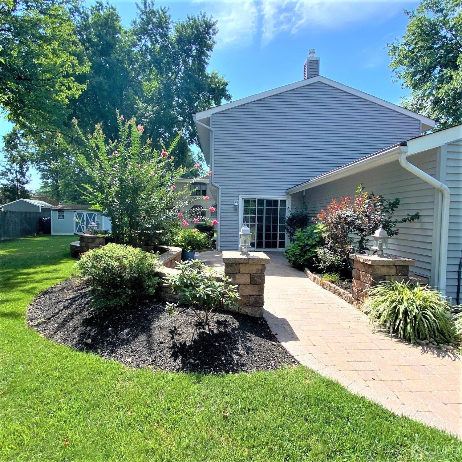 5 Timan Place Piscataway, NJ 08854 - Photo 2 of 27 a view of a house with a yard and plants