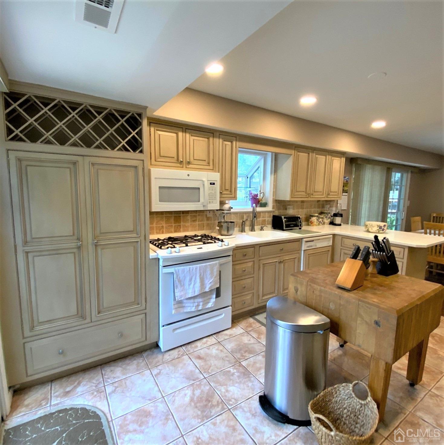 5 Timan Place Piscataway, NJ 08854 - Photo 24 of 27 a kitchen with a refrigerator and a sink