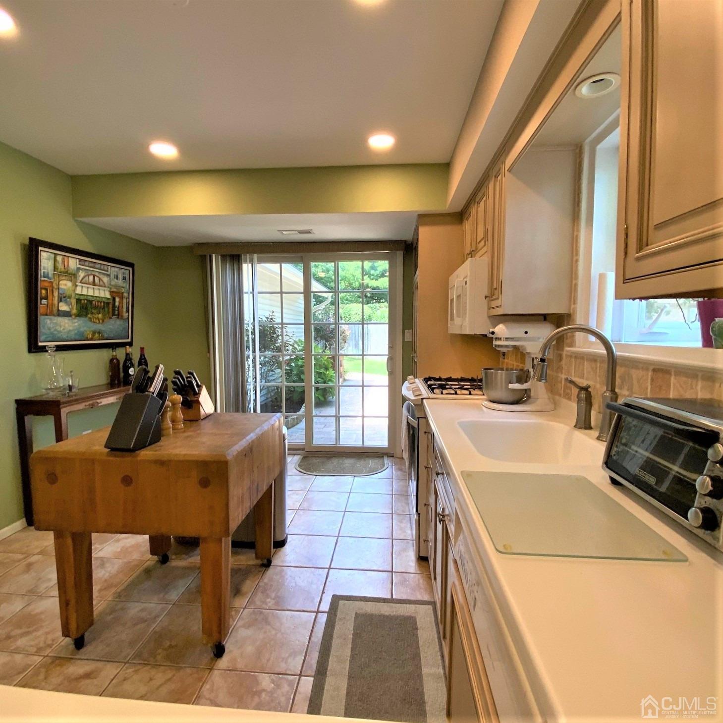 5 Timan Place Piscataway, NJ 08854 - Photo 26 of 27 a very nice looking dining room with a large window and stainless steel appliances