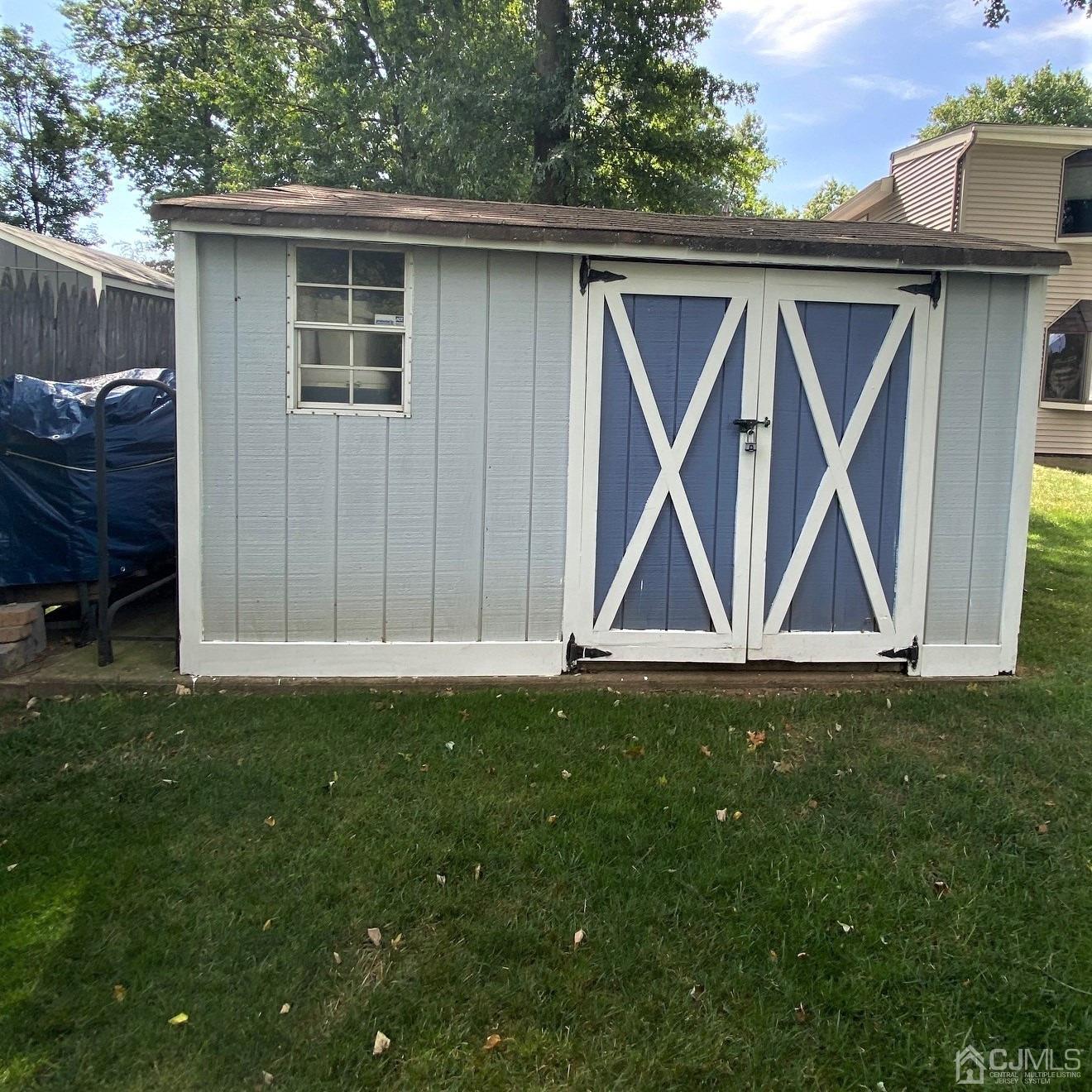 5 Timan Place Piscataway, NJ 08854 - Photo 4 of 27 a backyard of a house with table and chairs