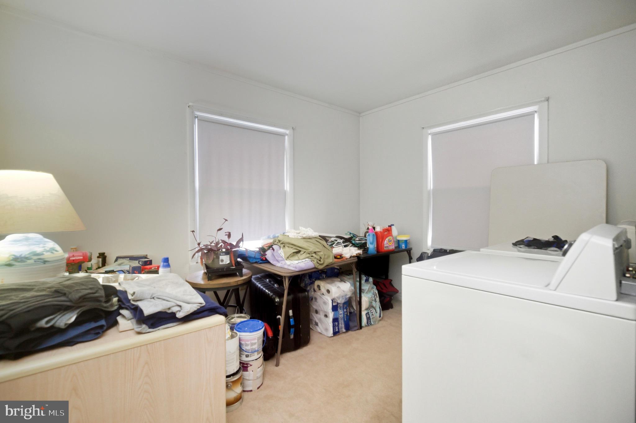 14 Buttercup Lane Willingboro, NJ 08046 - Photo 11 of 26 a storage room with washer and dryer