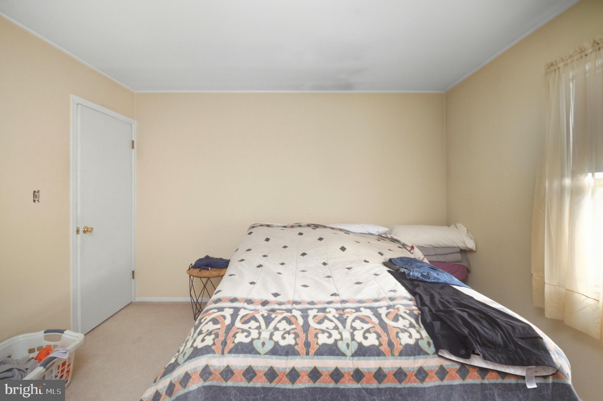14 Buttercup Lane Willingboro, NJ 08046 - Photo 15 of 26 a bedroom with a bed and a window