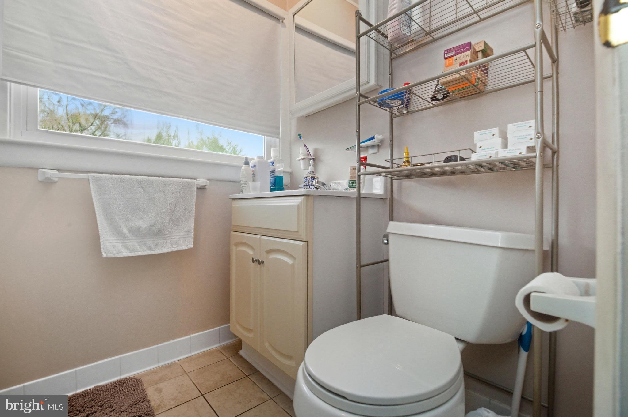 14 Buttercup Lane Willingboro, NJ 08046 - Photo 17 of 26 a white toilet sitting next to a bathroom sink