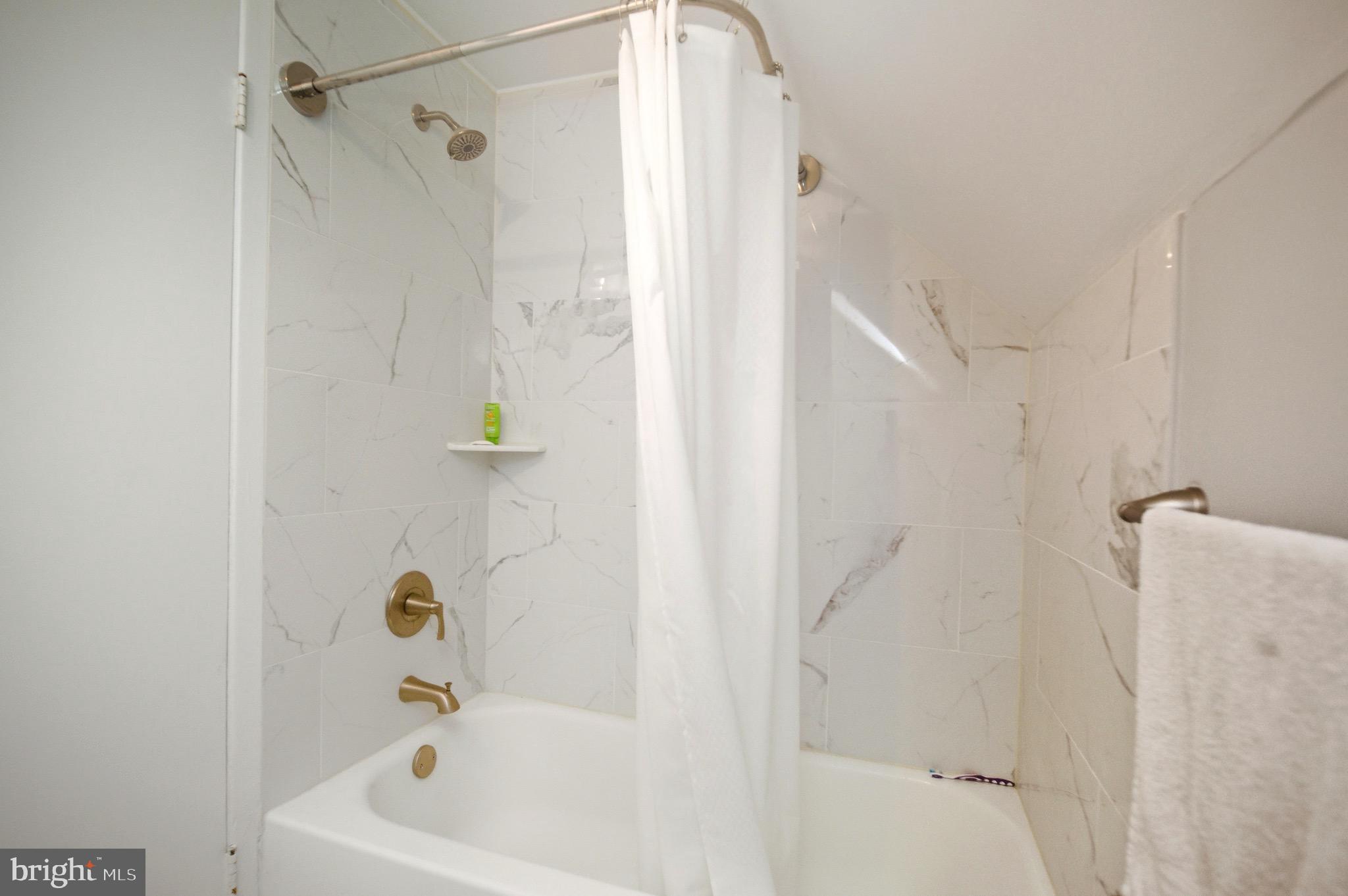 14 Buttercup Lane Willingboro, NJ 08046 - Photo 25 of 26 a bathroom with a bathtub and shower