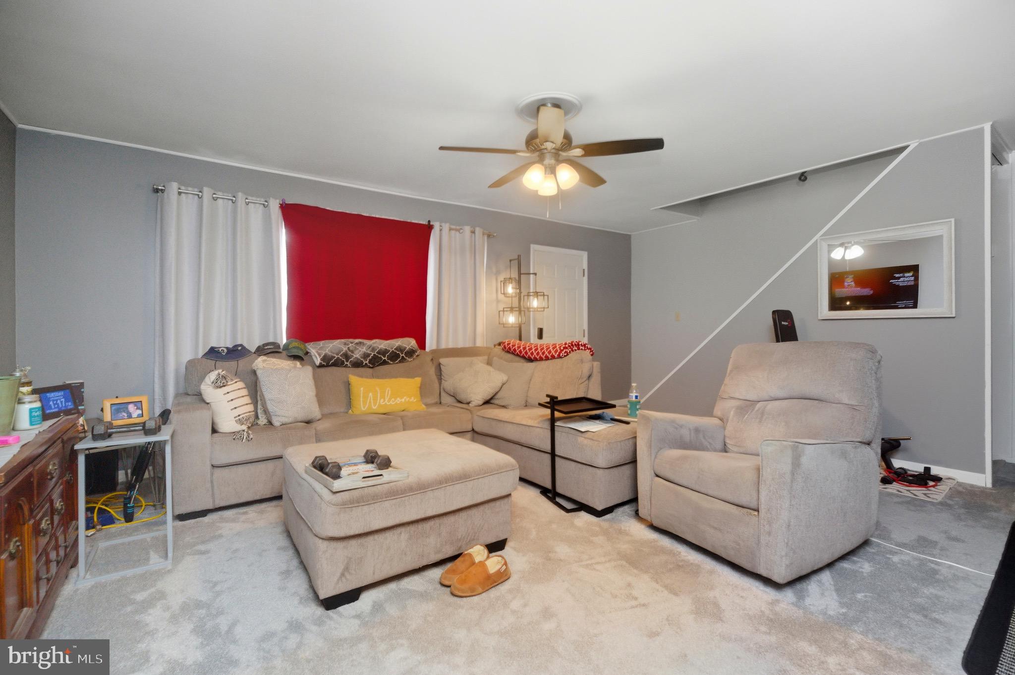 14 Buttercup Lane Willingboro, NJ 08046 - Photo 8 of 26 a living room with furniture and a chandelier