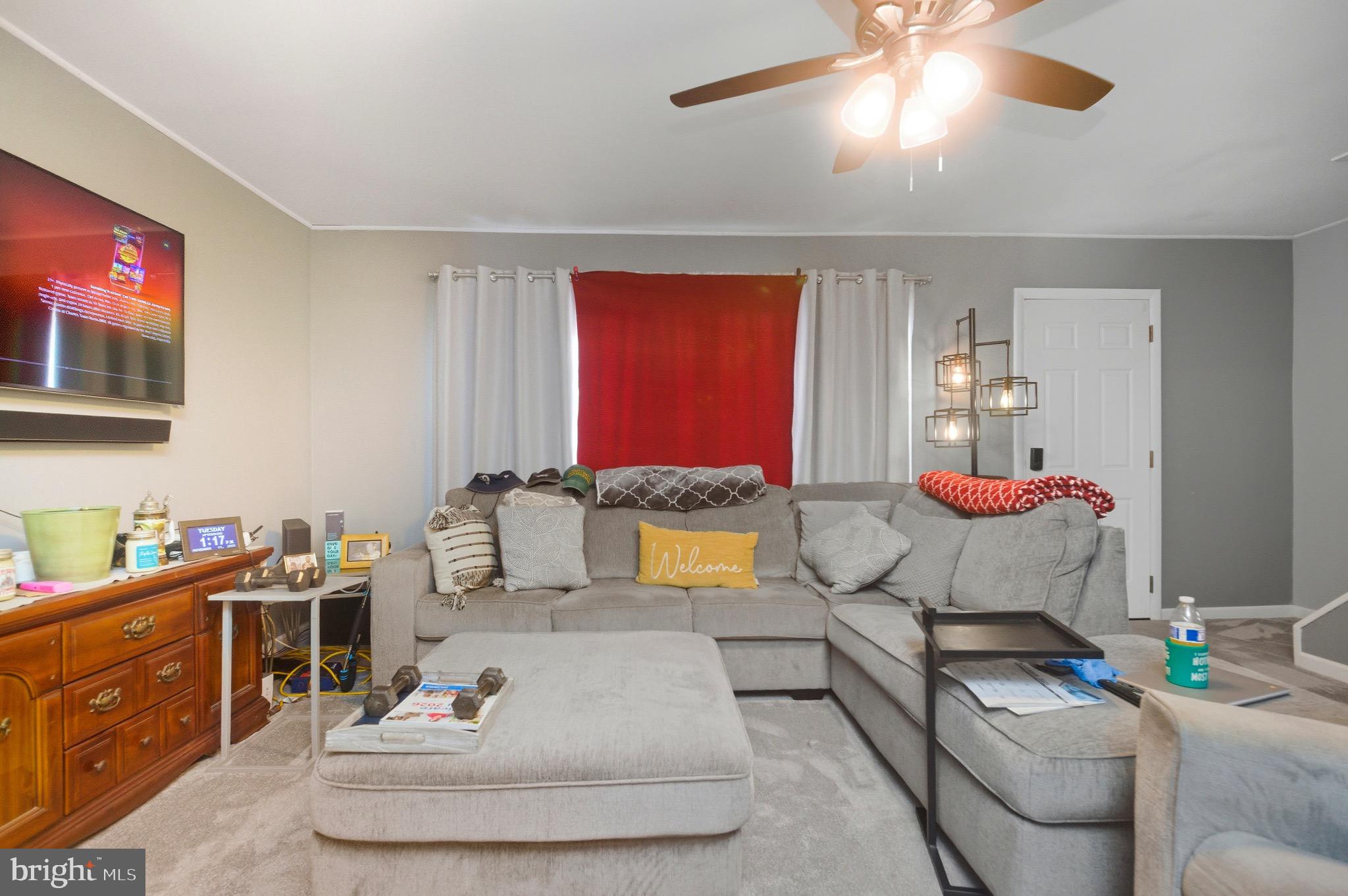 14 Buttercup Lane Willingboro, NJ 08046 - Photo 9 of 26 a living room with furniture and a flat screen tv