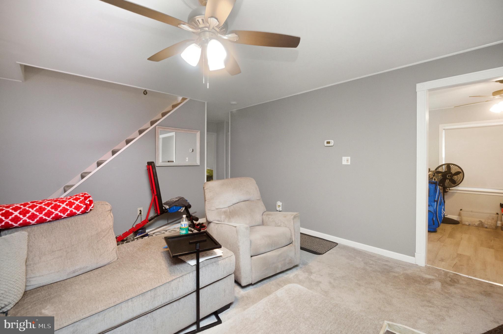 14 Buttercup Lane Willingboro, NJ 08046 - Photo 10 of 26 a living room with furniture and a chandelier