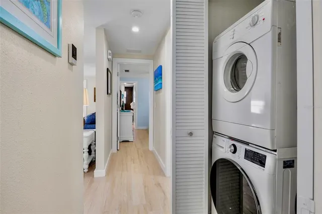 an aerial view of a house with garden space and a patio