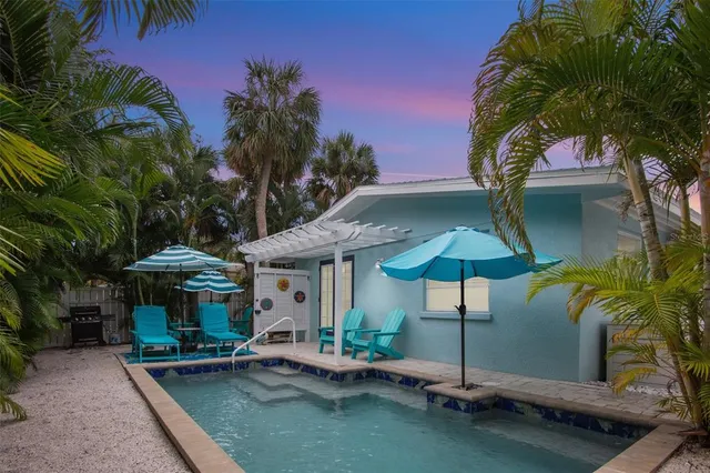 a patio with a table and chairs