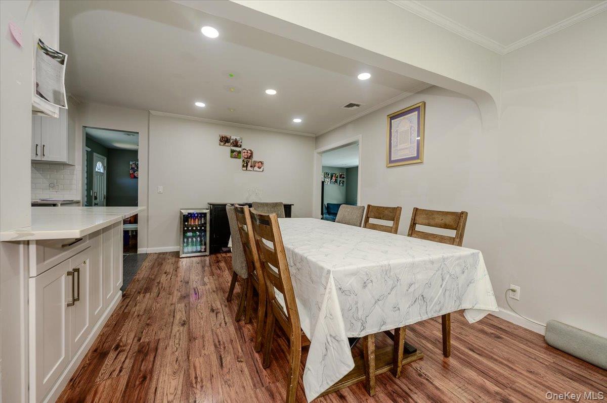 534 Allen Road Woodmere, NY 11598 - Photo 6 of 35 a bed room with a bed and a view of kitchen