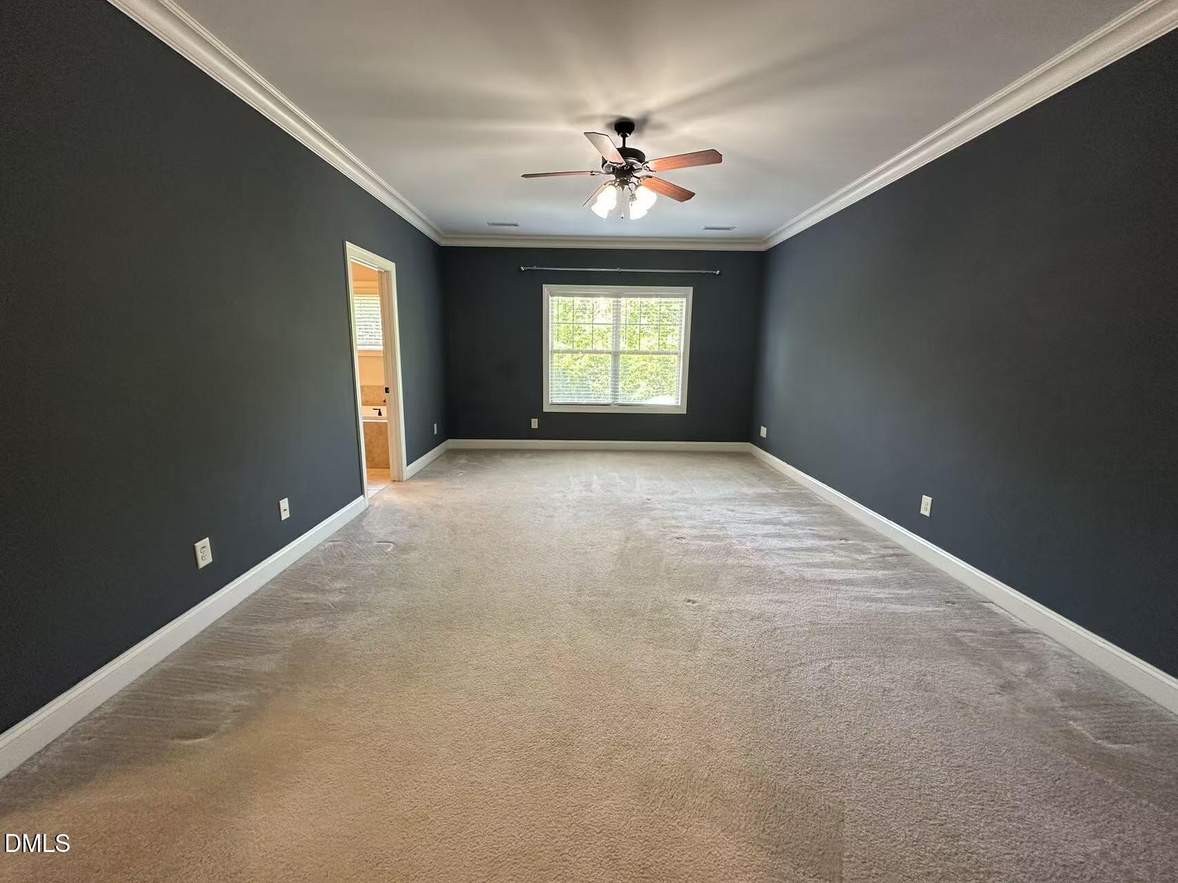 1056 Indigo Ridge Place Cary, NC 27519 - Photo 17 of 33 a view of an empty room with a window