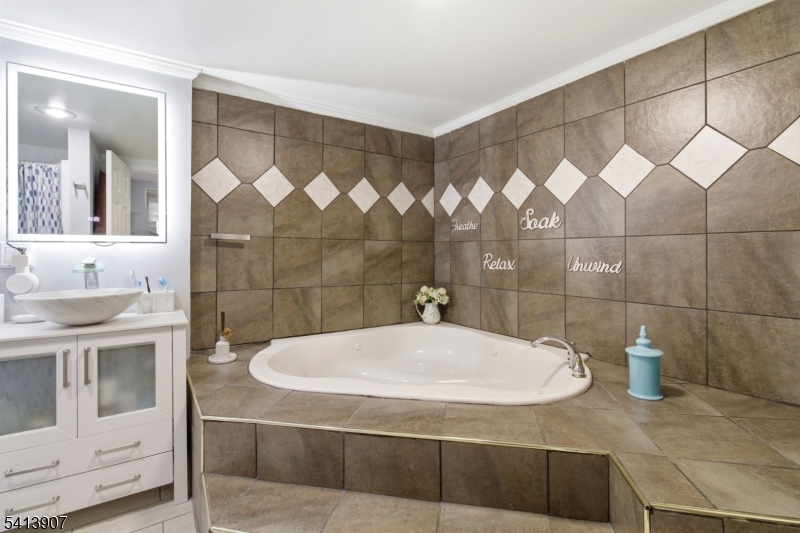 32 Cedar Avenue Elizabeth, NJ 07202 - Photo 24 of 32 a bathroom with a sink and a shower