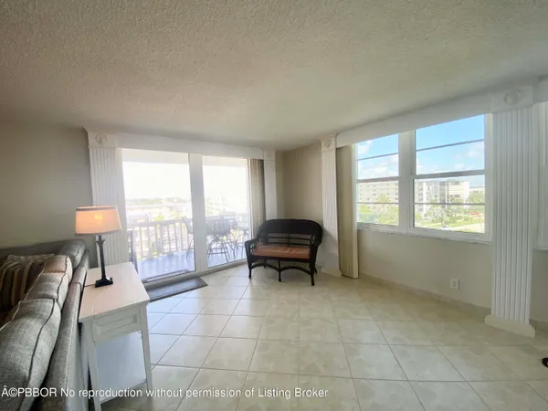a kitchen with granite countertop a sink and cabinets