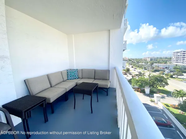 a view of a chairs and table in patio