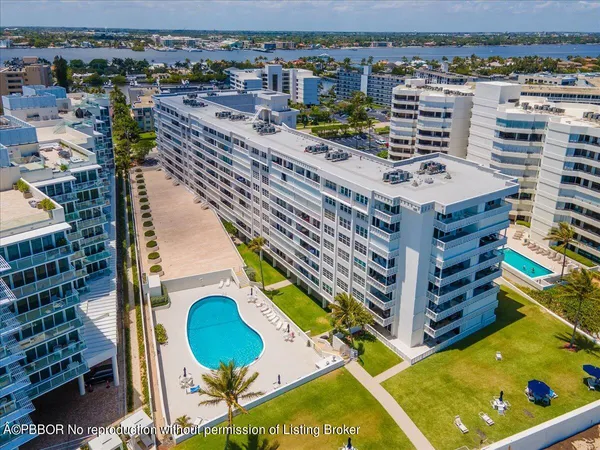 a view of swimming pool with a lounge chair
