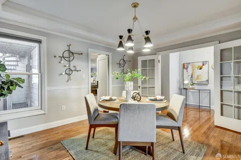 a kitchen with stainless steel appliances a stove a sink and a refrigerator