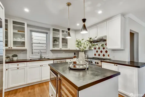 a kitchen with a dining table and chairs