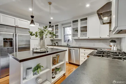 a living room with furniture a rug and a mirror