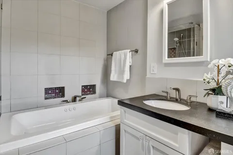 a view of an empty room with glass door and wooden floor