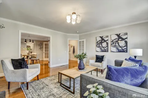 a view of a dining room with furniture and window