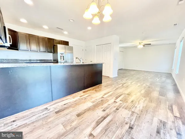 a view of kitchen with wooden floor