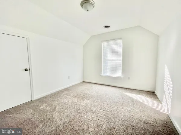 an empty room with a natural light