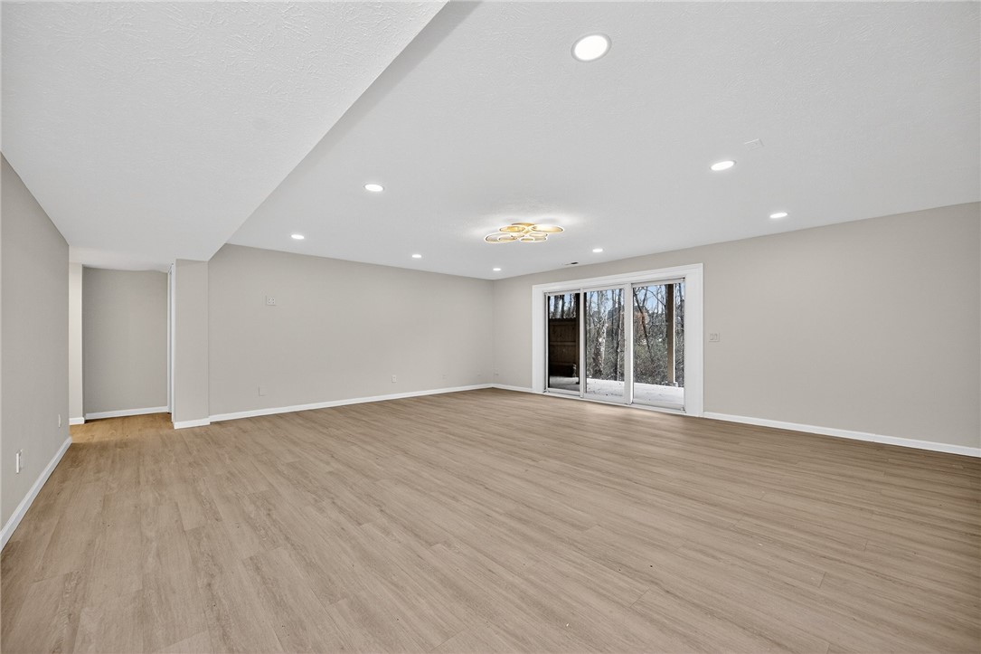 811 Wind Bluff Point Springboro, OH 45066 - Photo 36 of 51 This spacious open room features bright recessed lighting and direct outdoor access through sliding glass doors.