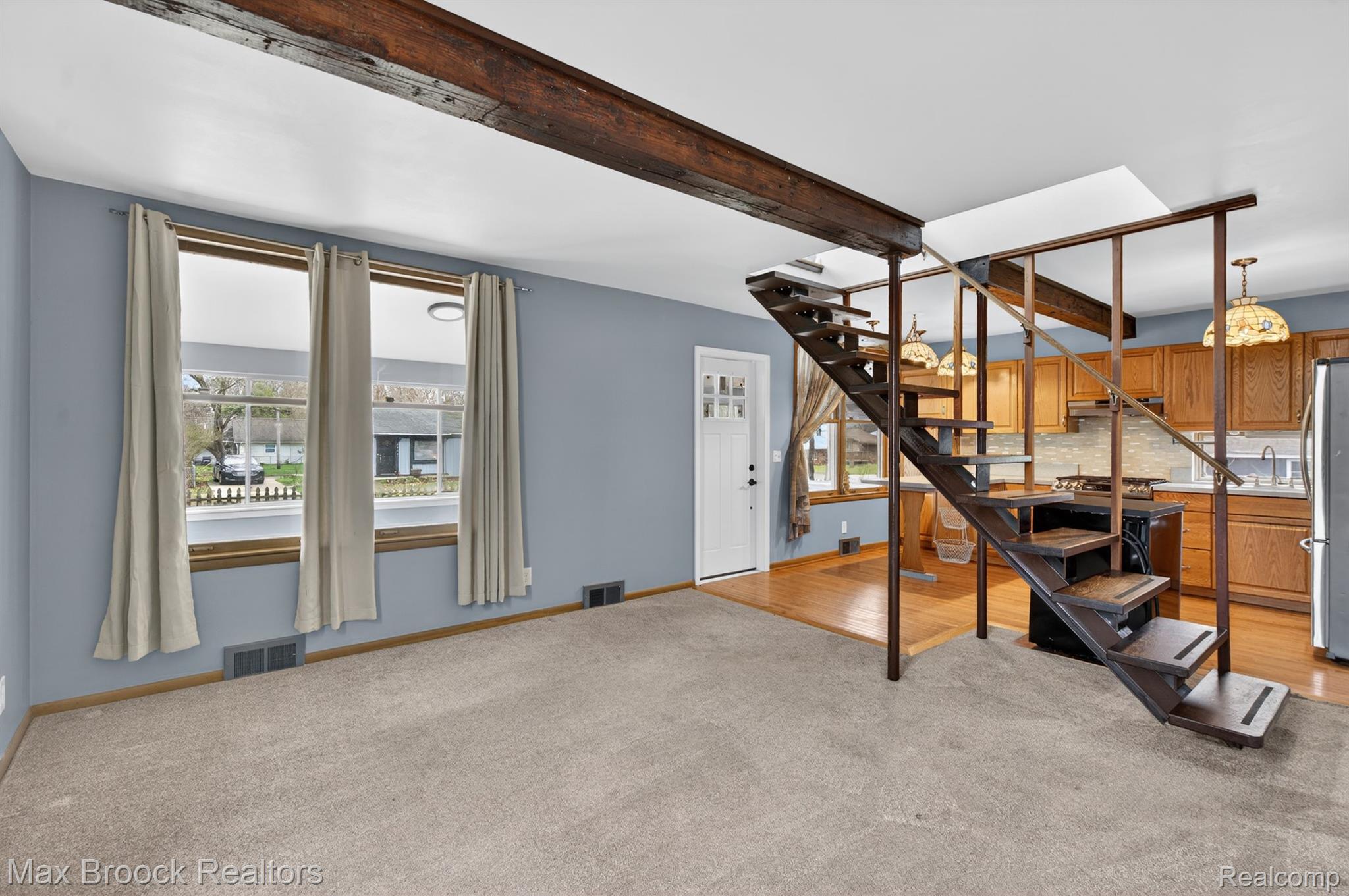 9024 Mandon Road White Lake, MI 48386 - Photo 10 of 39 Staircase featuring carpet floors and beamed ceiling