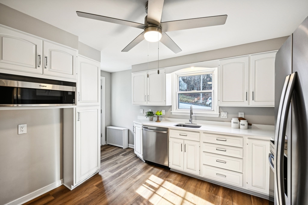 49 Dellwood Road Worcester, MA 01602 - Photo 13 of 27 a kitchen with a stove a sink and a refrigerator