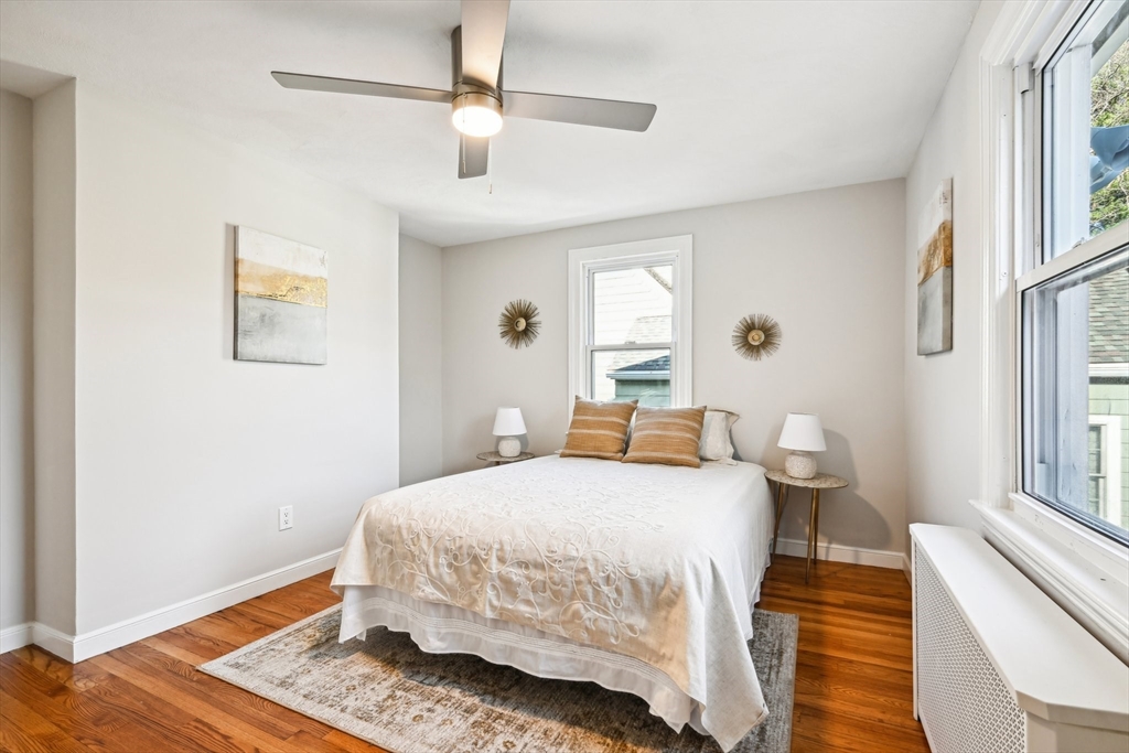 49 Dellwood Road Worcester, MA 01602 - Photo 17 of 27 a bedroom with a bed and wooden floor