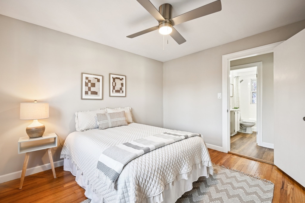 49 Dellwood Road Worcester, MA 01602 - Photo 20 of 27 a bedroom with a bed and wooden floor