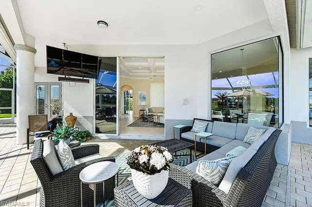 a living room with furniture fireplace and a flat screen tv