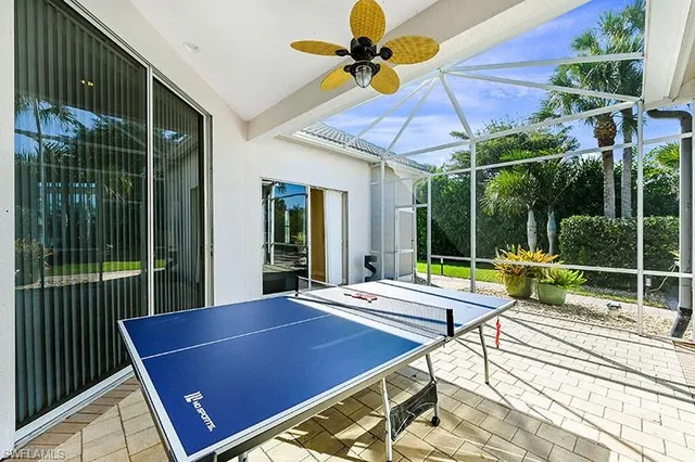 a view of a backyard with a table and chairs