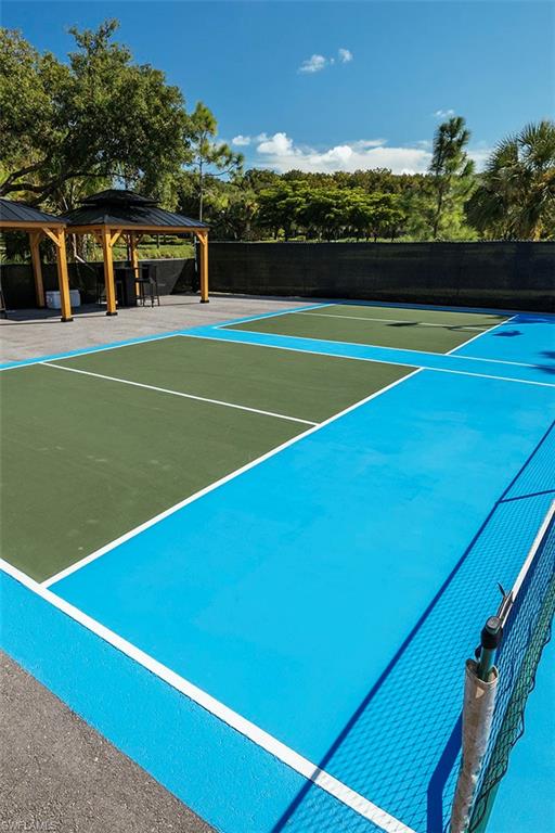 11234 5 Oaks Lane Naples, FL 34120 - Photo 29 of 34 a view of a tennis court